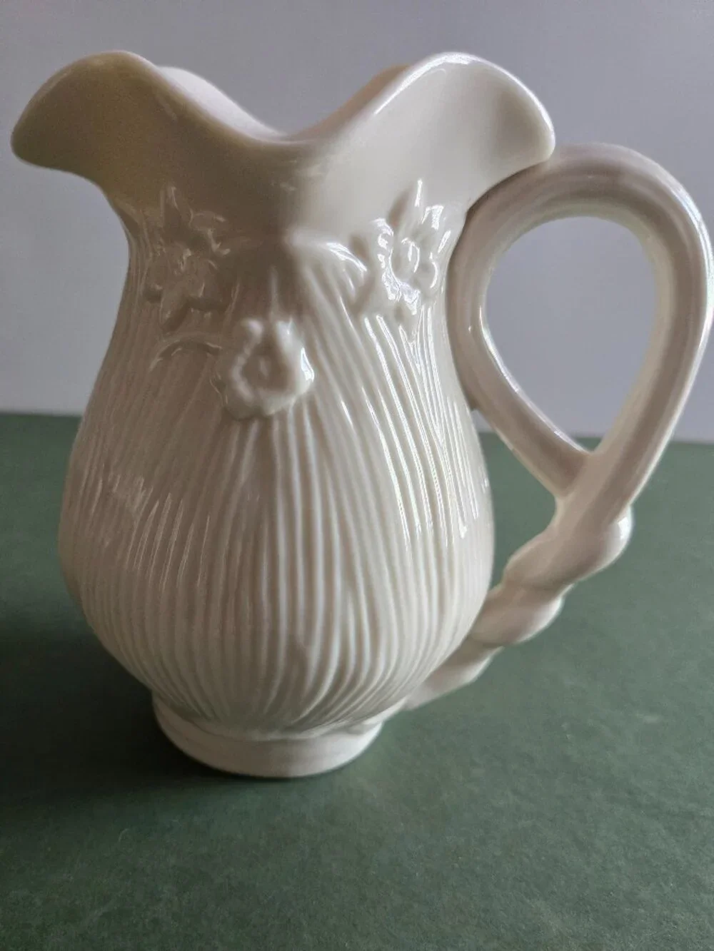Pair of Ivory Bisque Pitchers